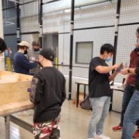 people standing at two senior projects